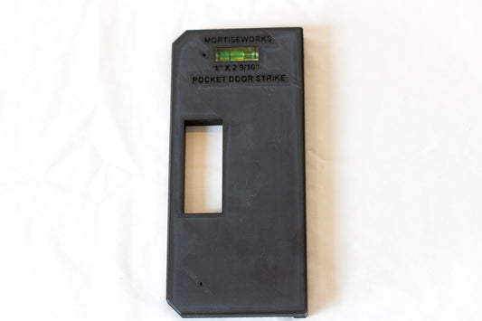 Privacy pocket door latch strike jig